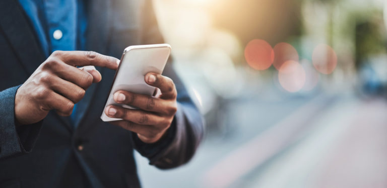 Man's hands on phone